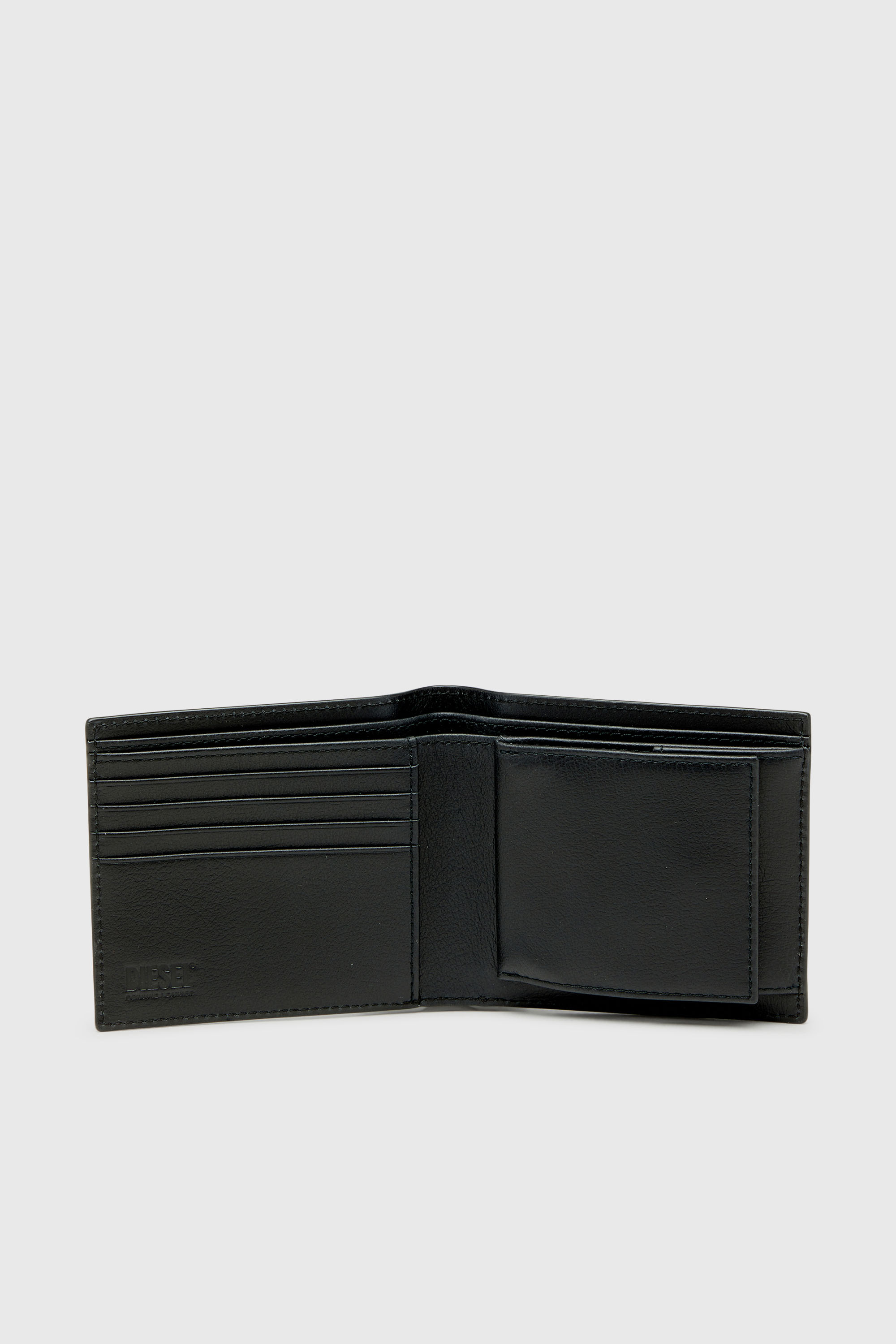 Diesel - MONOGRAM BI-FOLD COIN S 3D, Man's Leather bi-fold wallet with all-over embossed logo in Black - 3